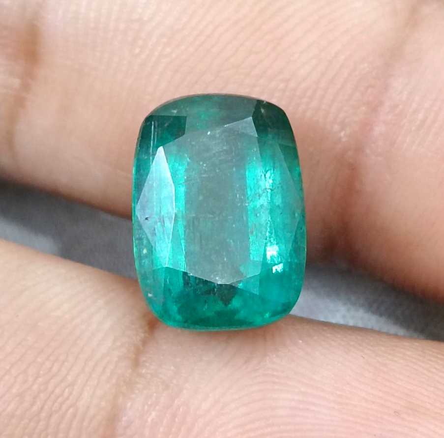 7.34ct Deep slightly bluish green cushion cut Zambian emerald.