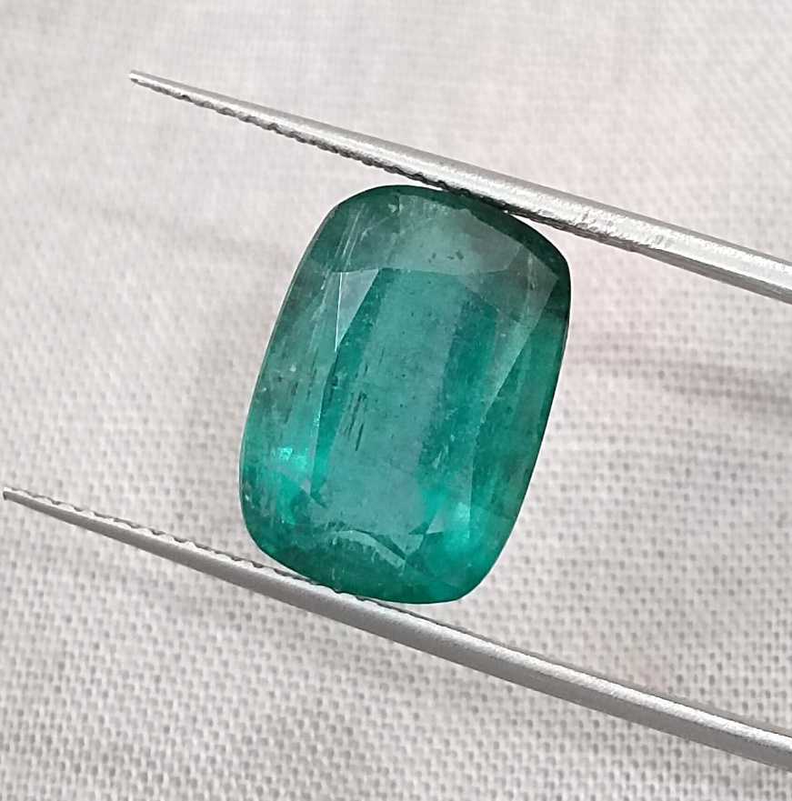 7.34ct Deep slightly bluish green cushion cut Zambian emerald.