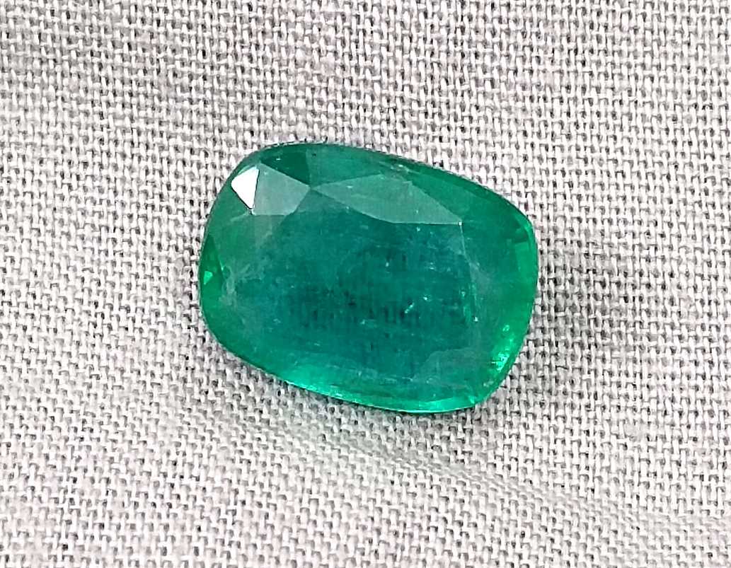 5.36ct Deep pure green cushion cut Zambian emerald.
