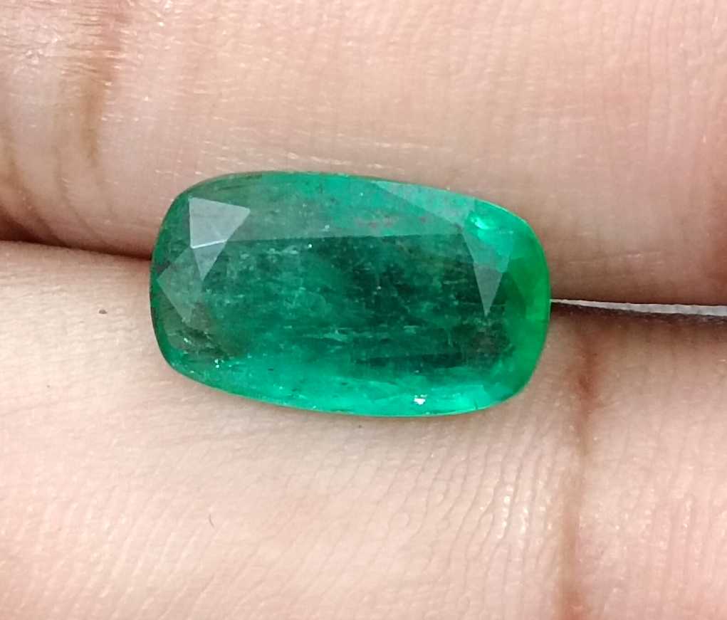 3.99ct Deep green cushion cut Zambian emerald.