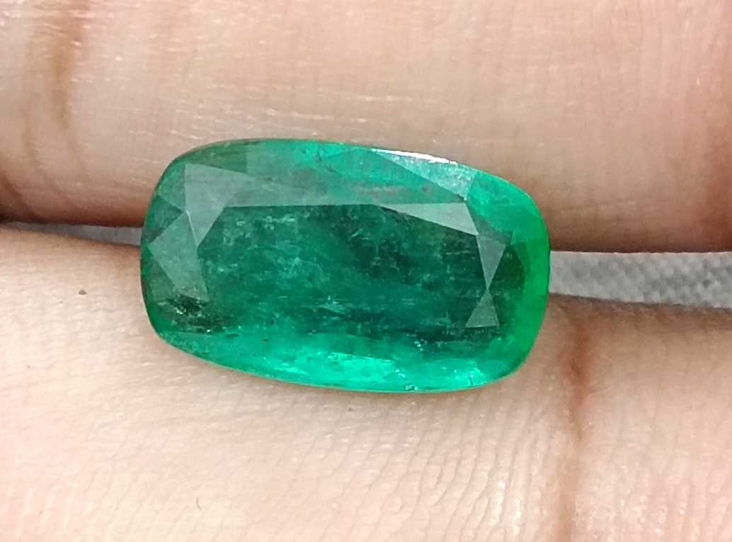 3.99ct Deep green cushion cut Zambian emerald.