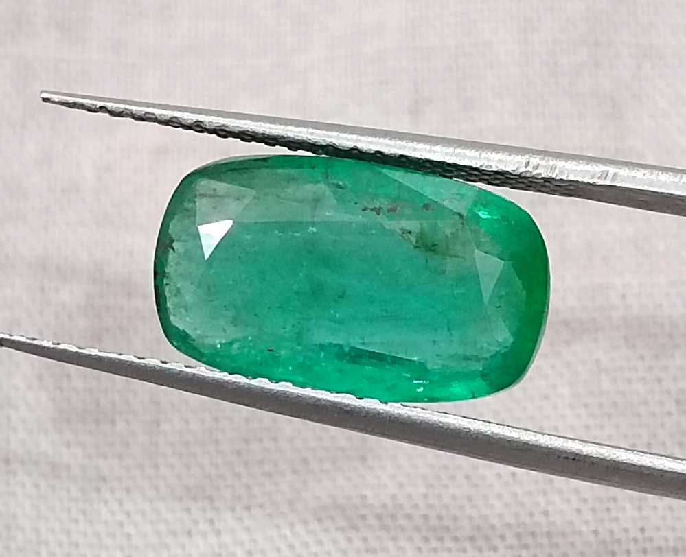 3.99ct Deep green cushion cut Zambian emerald.