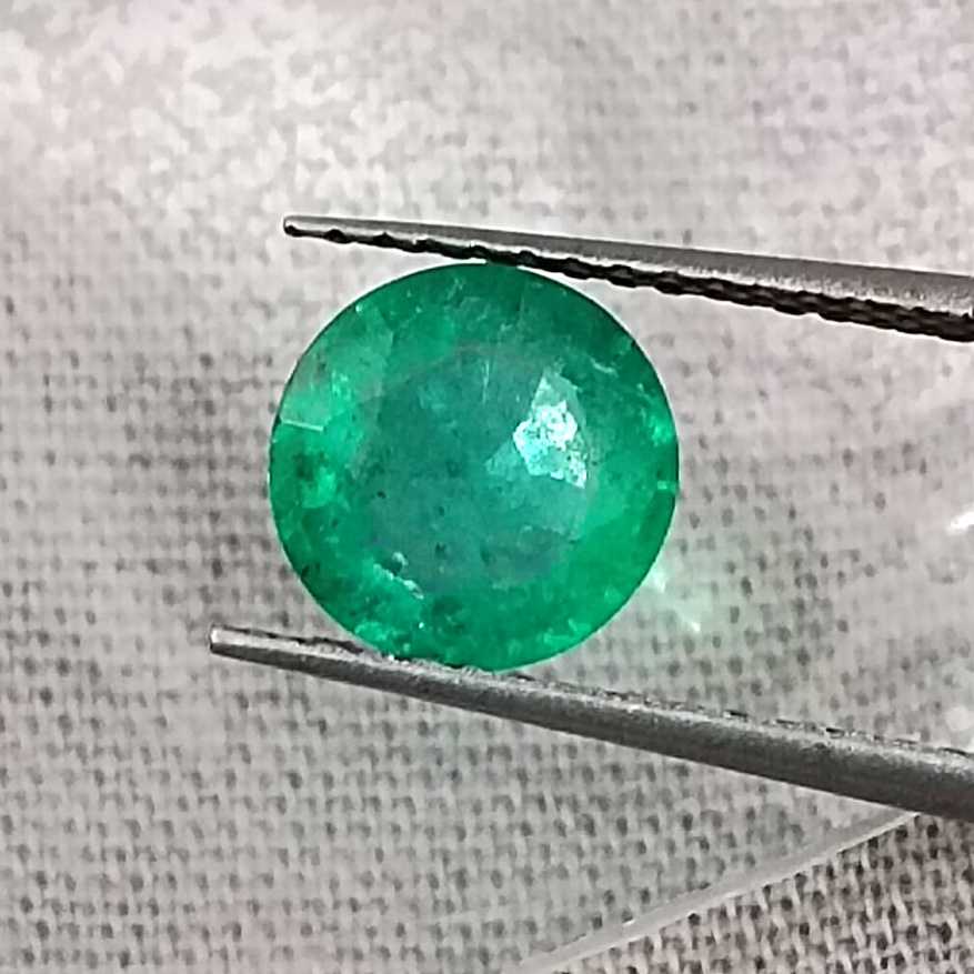 1.00ct GSI certified medium bright shamrock green Zambian emerald round cut