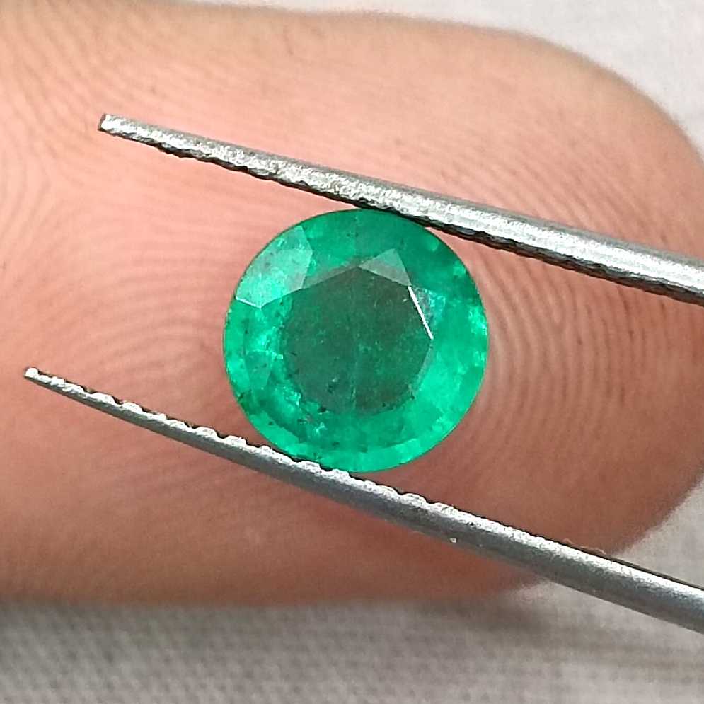 1.00ct GSI certified medium bright shamrock green Zambian emerald round cut