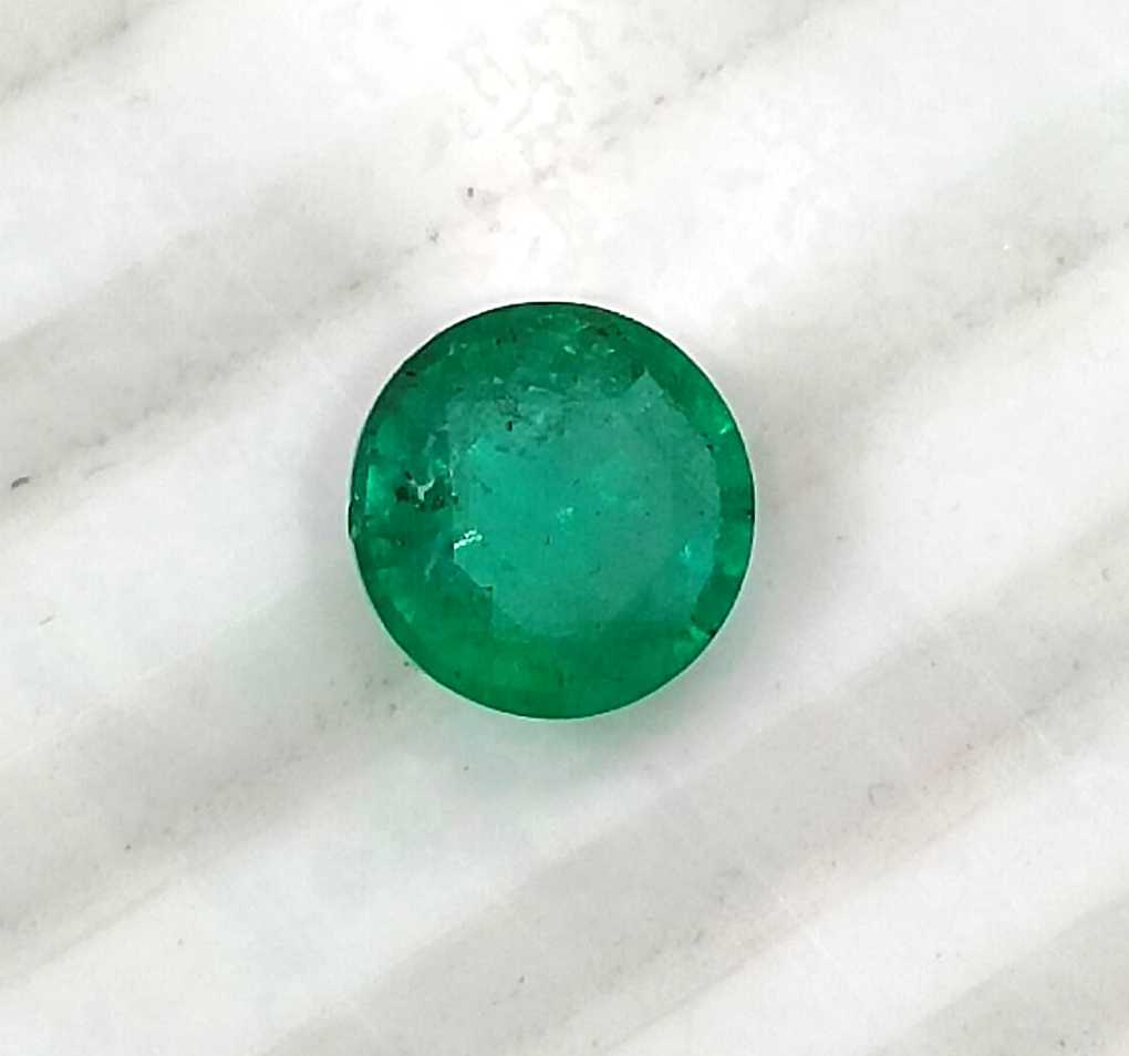 1.00ct GSI certified medium bright shamrock green Zambian emerald round cut