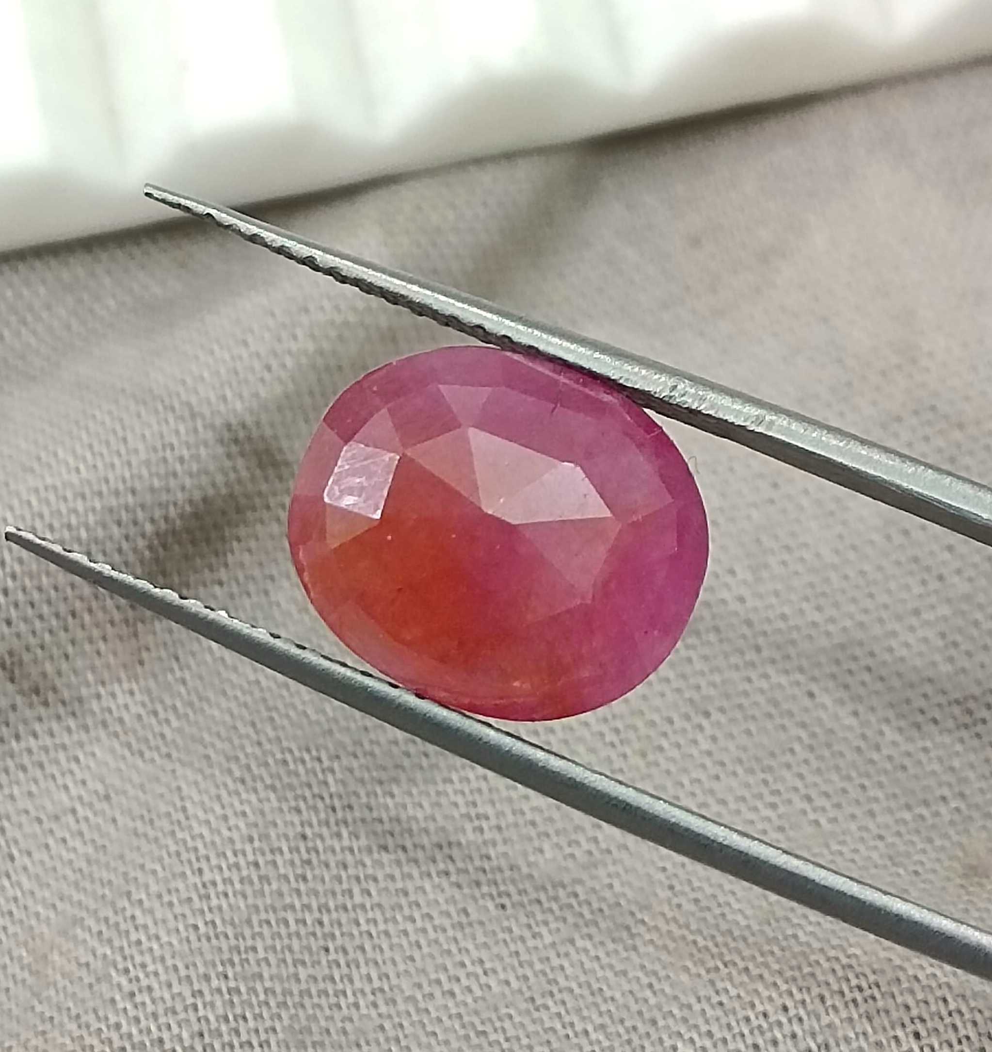 5.54ct GSI certified Mozambique ruby orangy red oval cut stone 