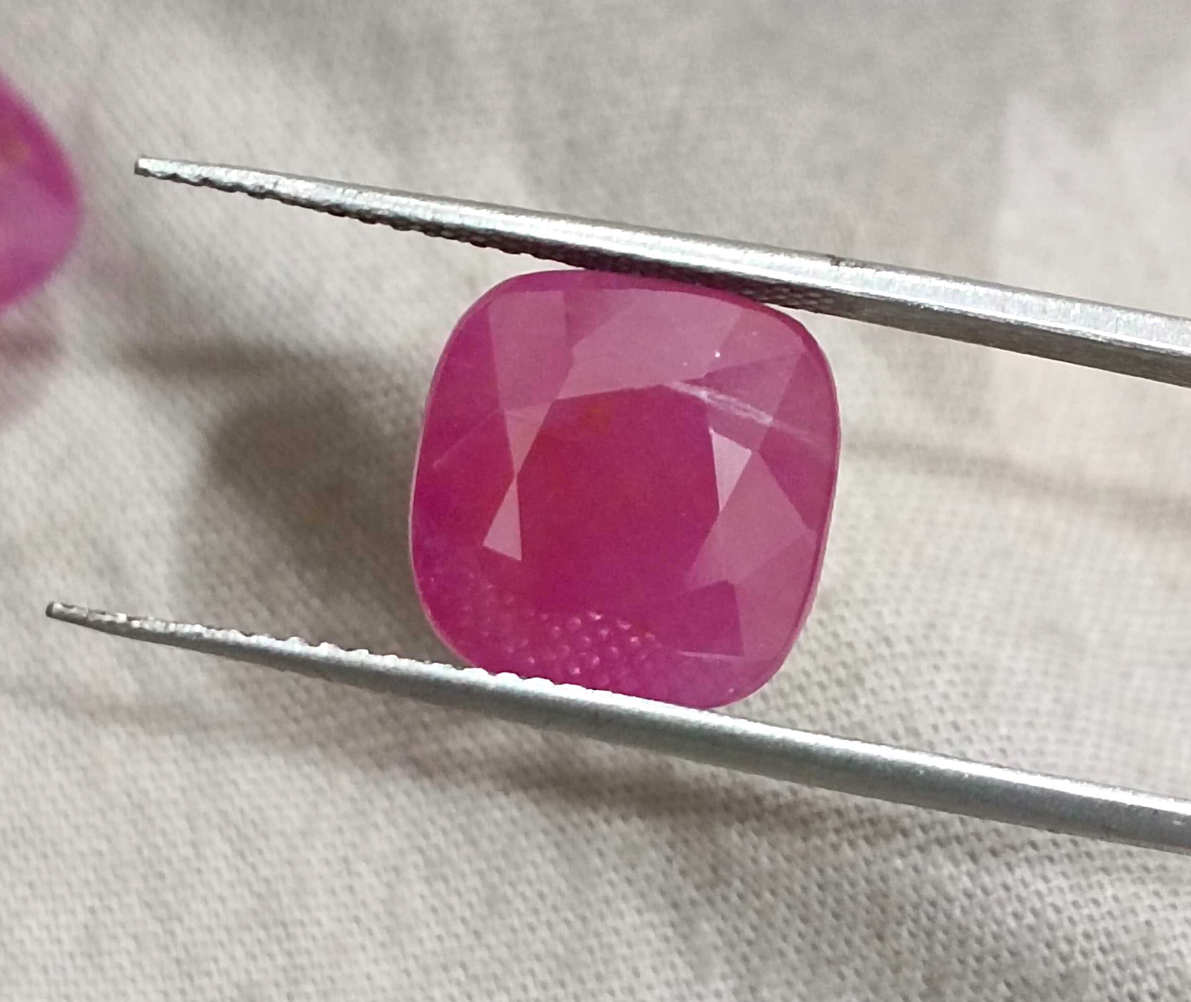 15.02ct Certified matching African ruby pair cushion cut purplish red stones