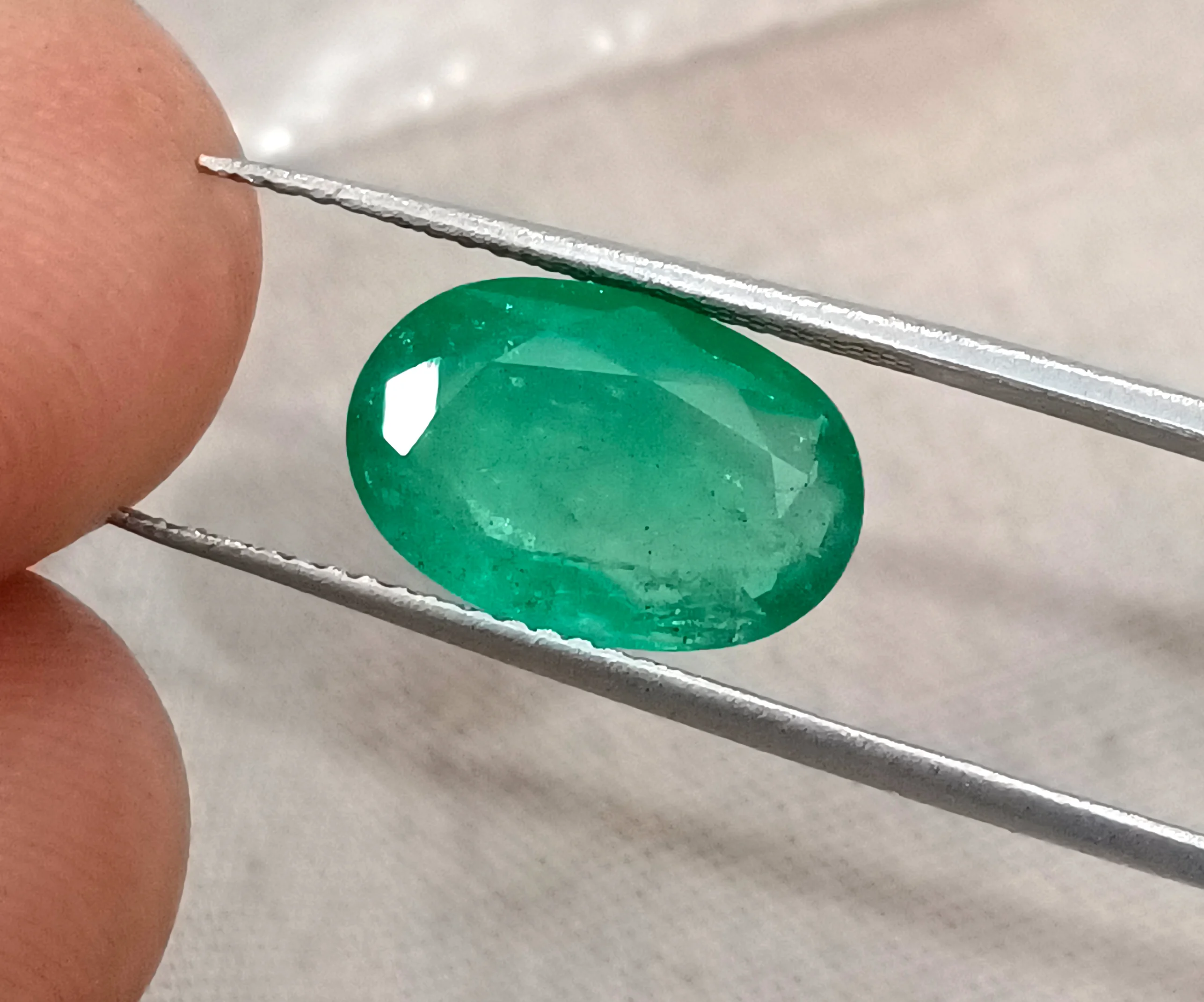 3.41ct Emerald medium spring green SGL certified oval gemstone