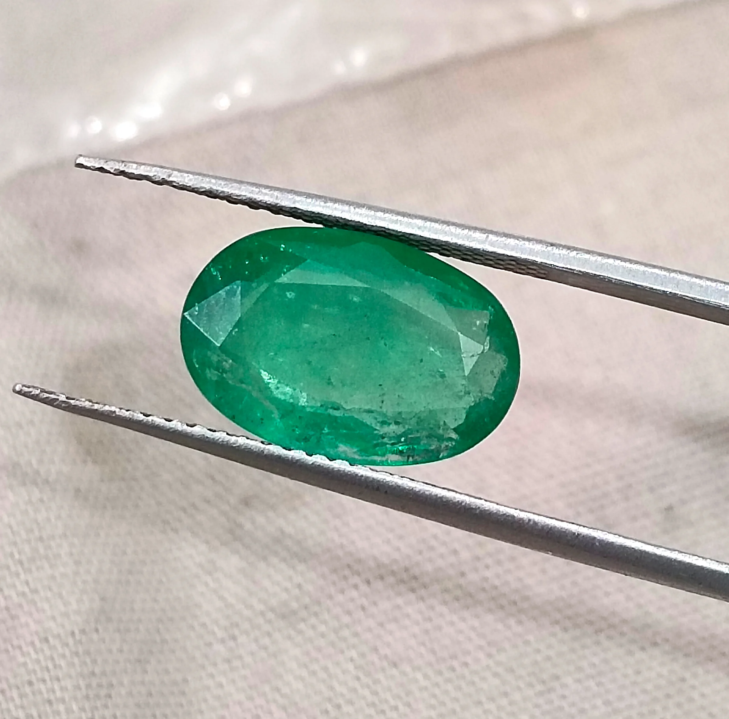 3.41ct Emerald medium spring green SGL certified oval gemstone