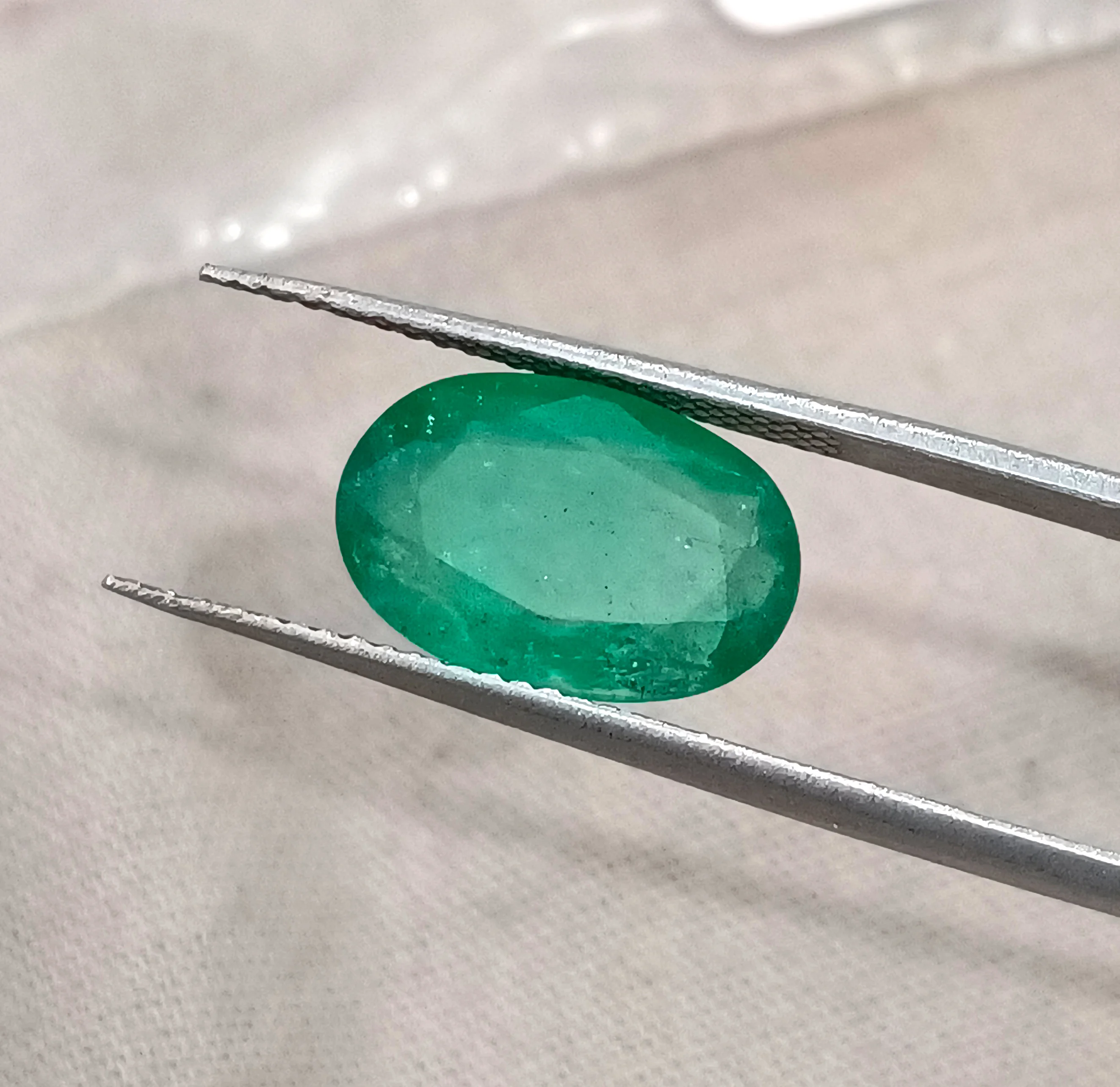 3.41ct Emerald medium spring green SGL certified oval gemstone