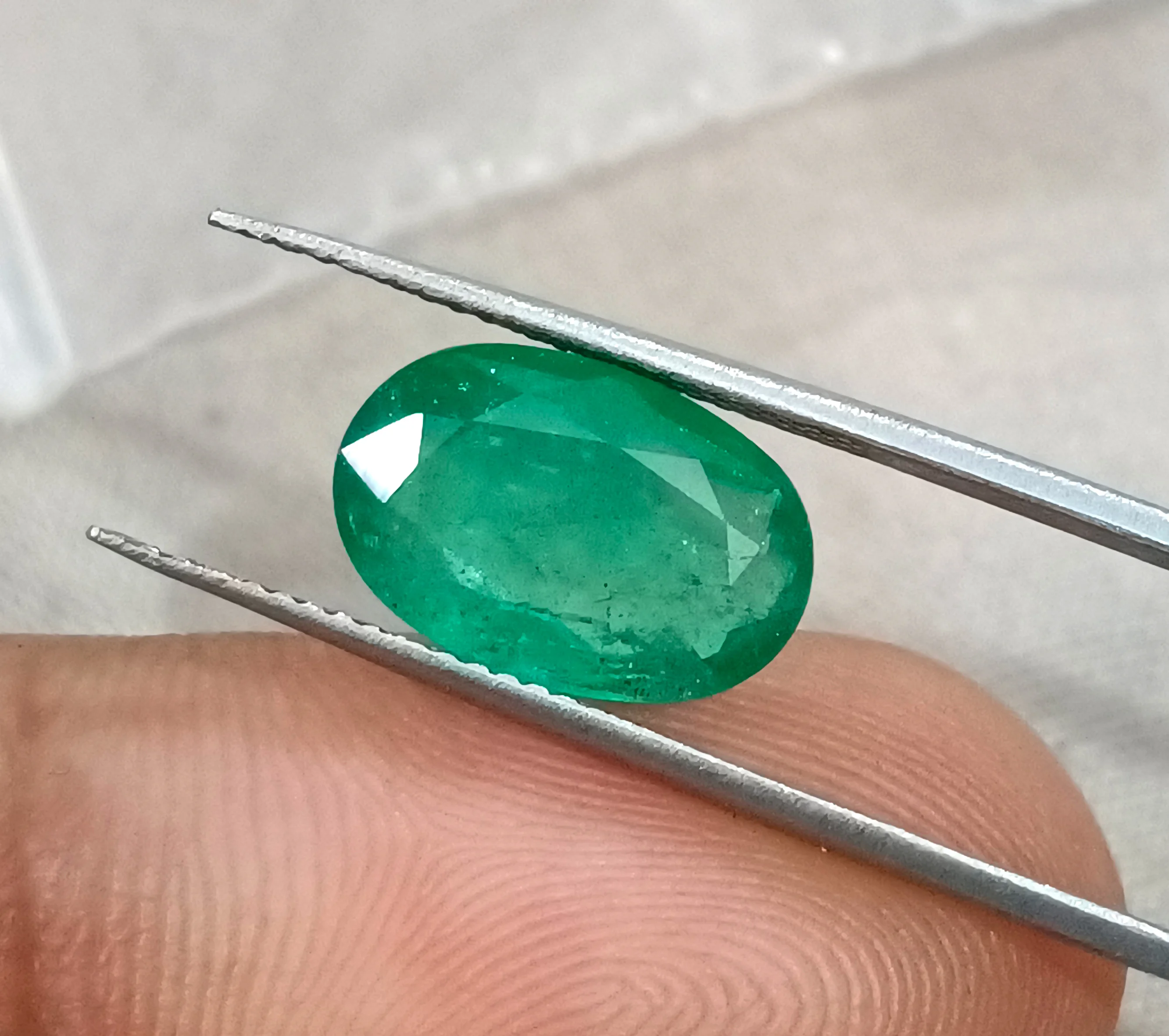 3.41ct Emerald medium spring green SGL certified oval gemstone