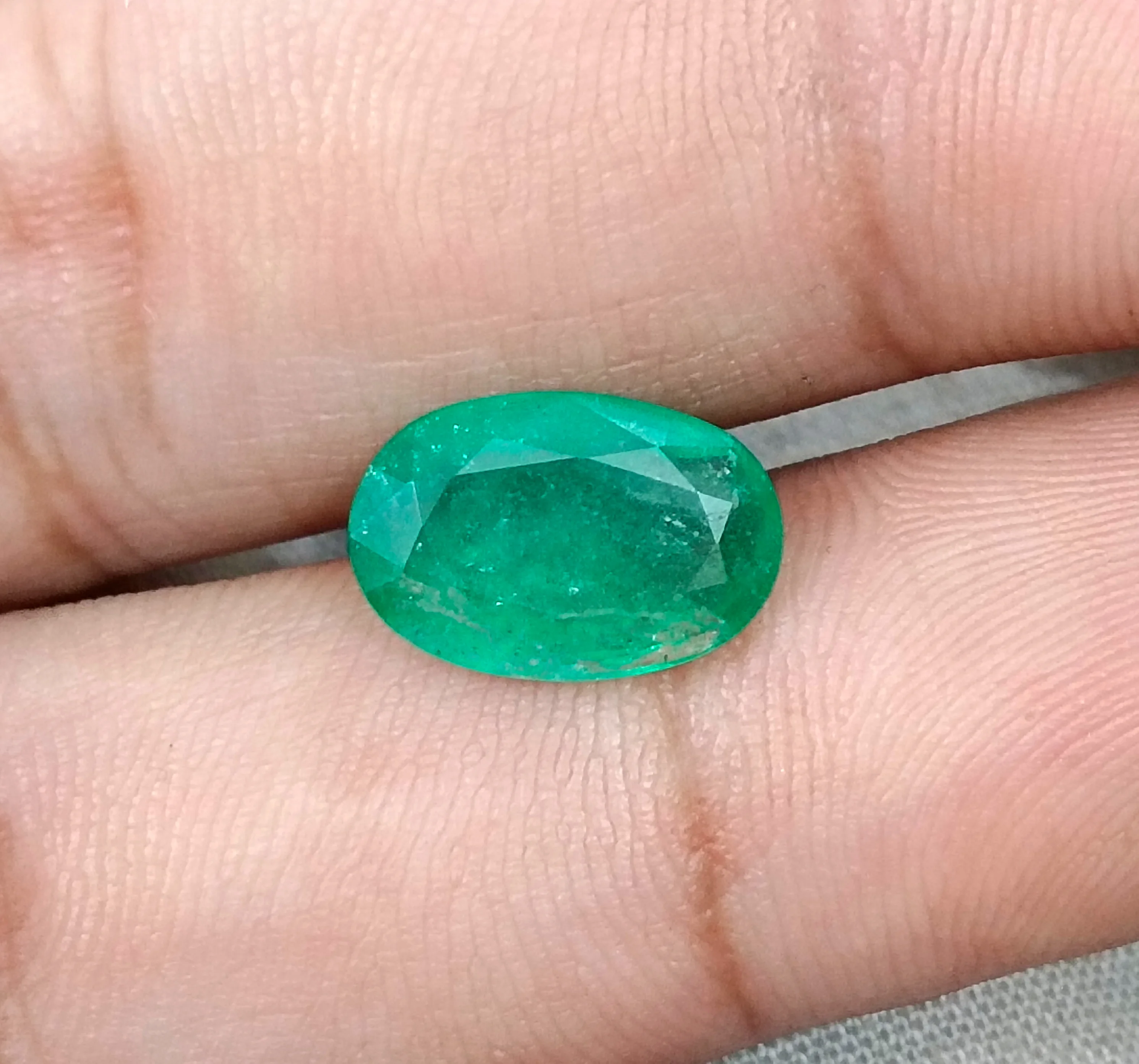 3.41ct Emerald medium spring green SGL certified oval gemstone